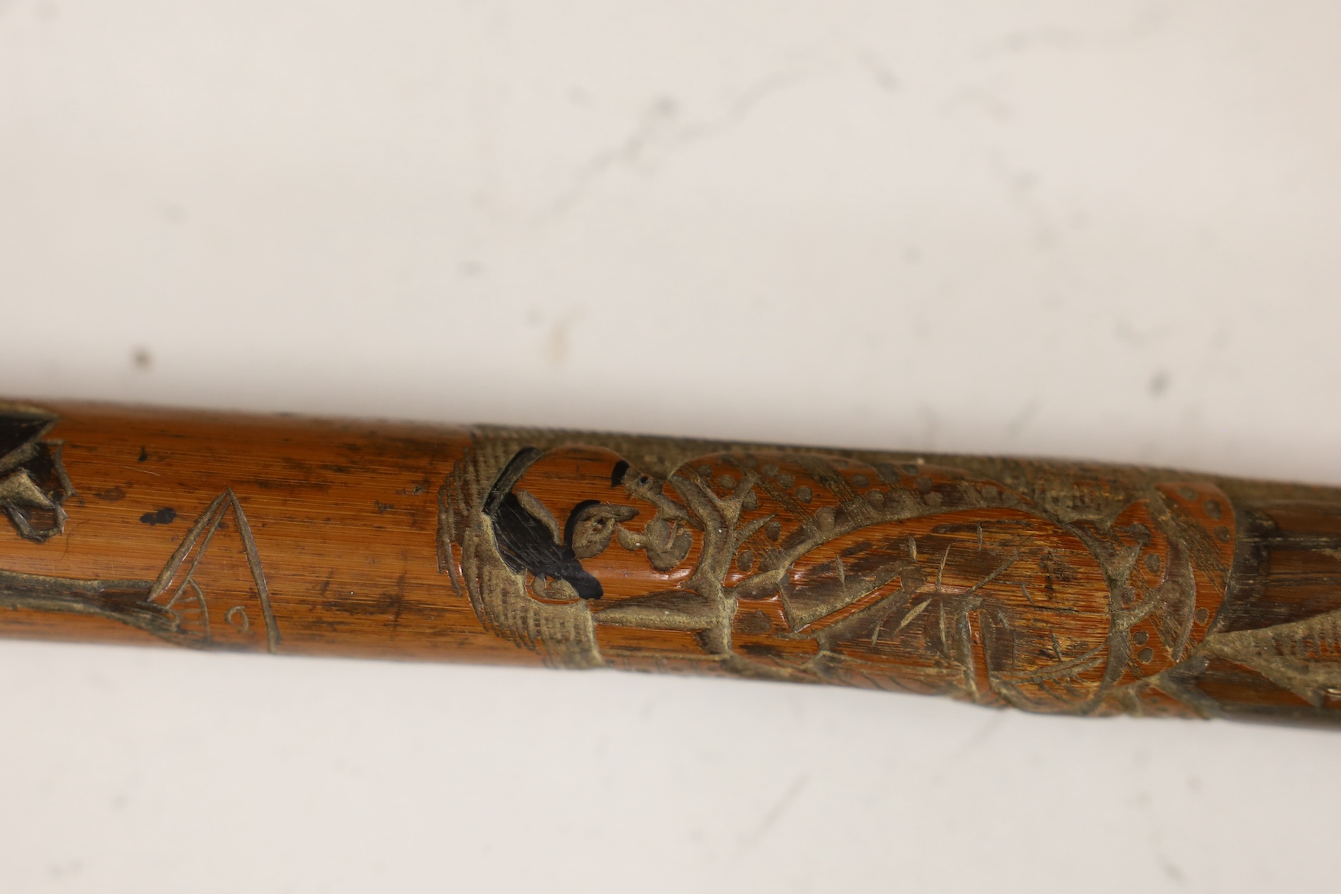 A Japanese carved and signed walking cane, 87cm high. Condition - fair to good